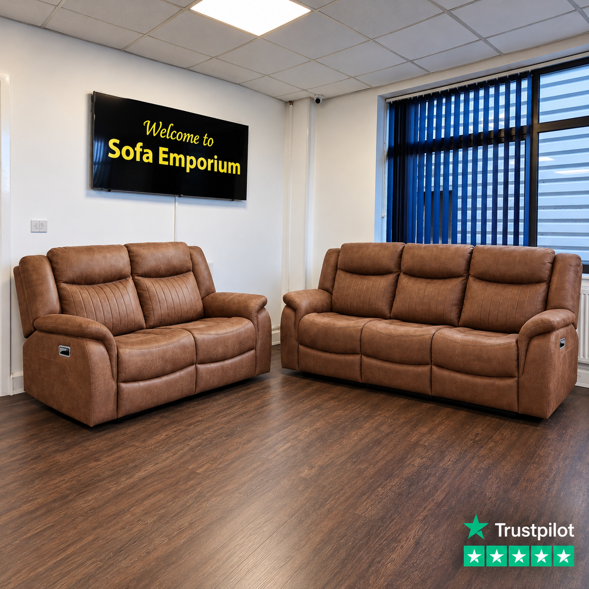 Darlington fabric reclining 3-seater and 2-seater sofas featuring padded armrests, vertical stitched backrests and electric recliner controls, displayed in the Sofa Emporium showroom.