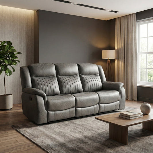Gray sofa in a modern living room with a lamp, plant, and coffee table.