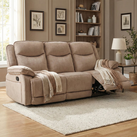 Beige recliner sofa in a living room setting with a rug and bookshelf.
