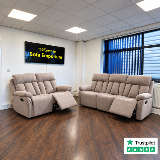 Taupe fabric two-seater and three-seater reclining sofas with padded arms and extended footrests, displayed in the Sofa Emporium showroom.