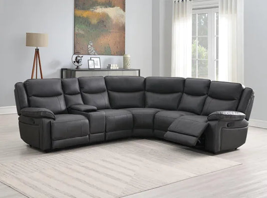 Black leather sectional sofa in a living room setting with a painting and lamp in the background.